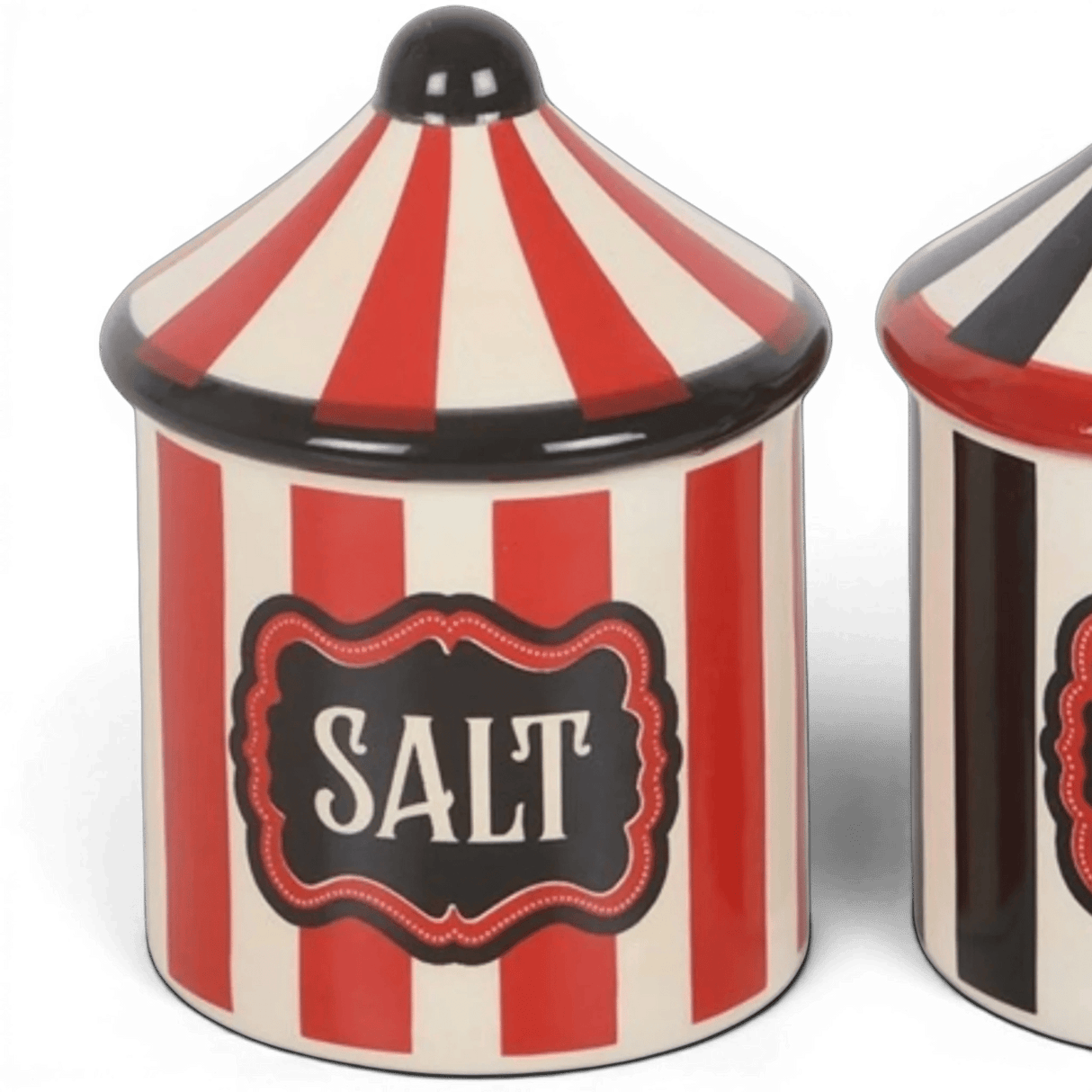 Close-up of circus tent salt shaker with SALT label and red-and-white striped body