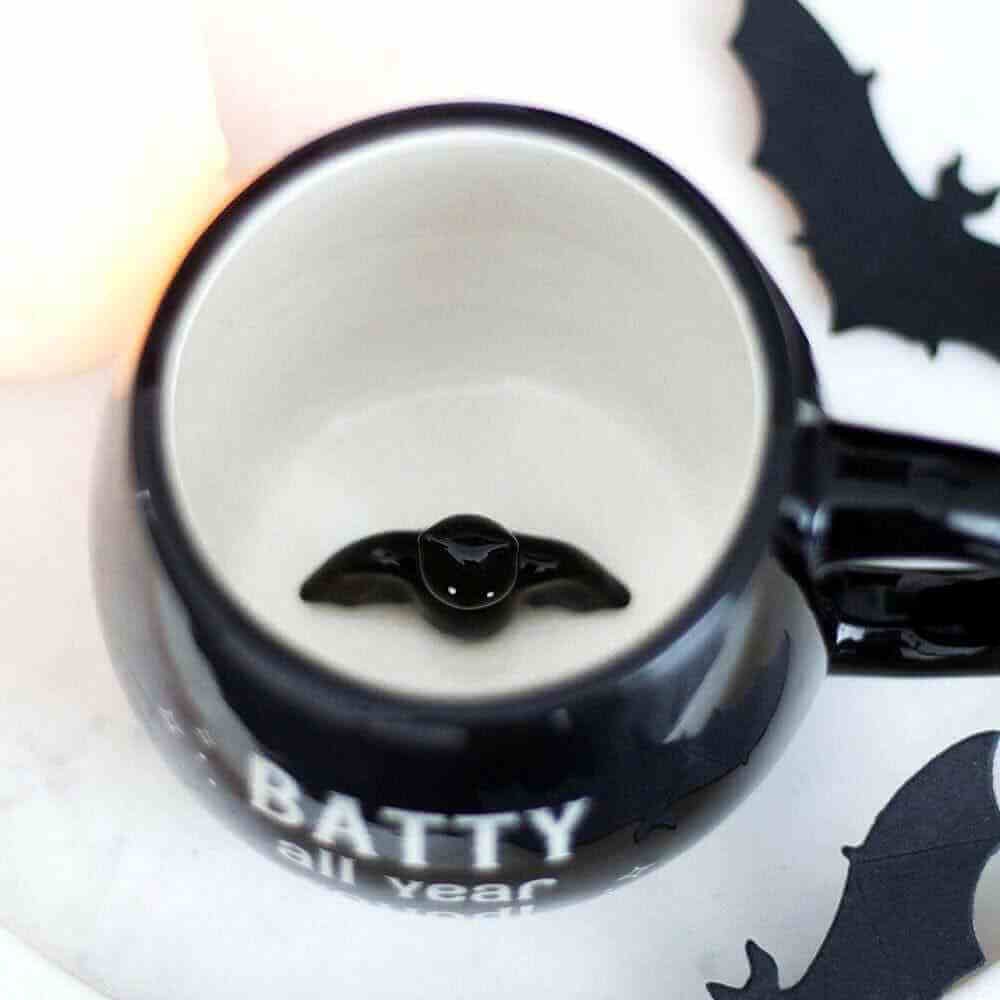 The Batty All Year Black Mug features a delightful hidden Bat design! by Spirit of equinox