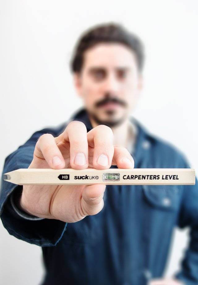 Carpenter's level pencil with spirit vial, held horizontally by a hand.