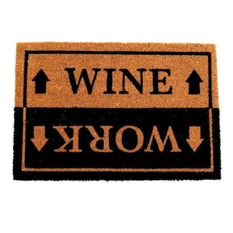 Rectangular doormat showing WINE and WORK text with arrow symbols, orange and black