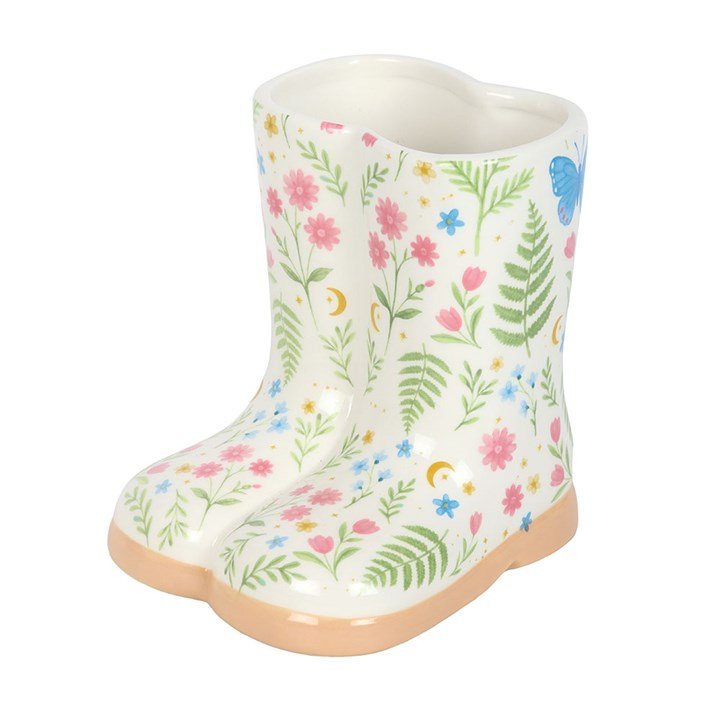 Ceramic floral welly boot planter with botanical print, small indoor plant pot on a white background.