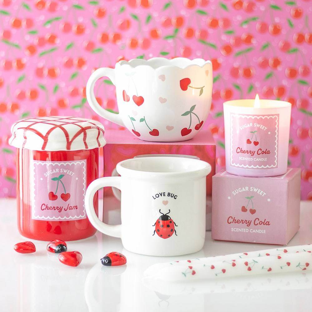 White scalloped heart mug with red and pink hearts and green cherry stems