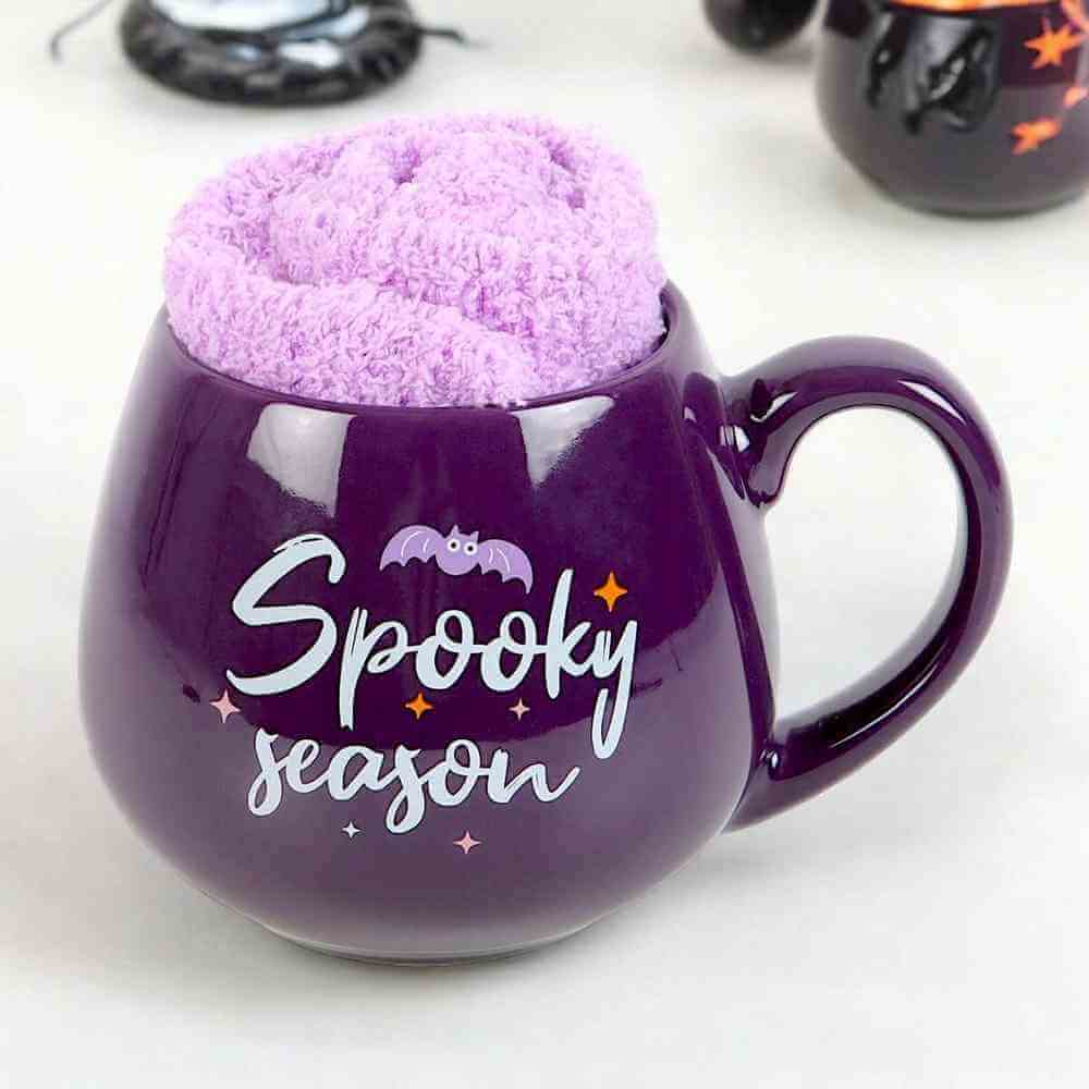 The Fashion Gift Shop: Spooky Season Mug and Lilac Socks Set for Cozy Nights by Spirit of equinox, Mugs and Cups