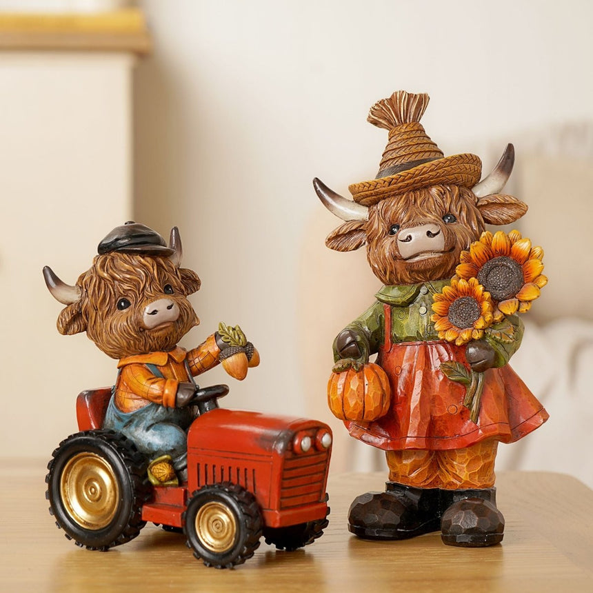 The Fashion Gift Shop: Highland Cow sits happily on a tractor, creating a charming rural scene by Country Living, Animal Ornament