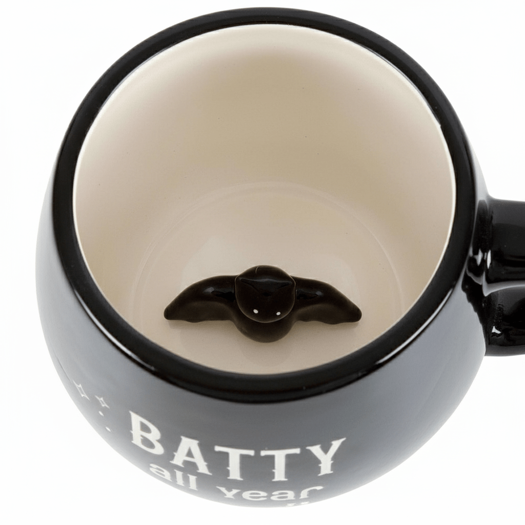 The Batty All Year Black Mug features a delightful hidden Bat design! by Spirit of equinox