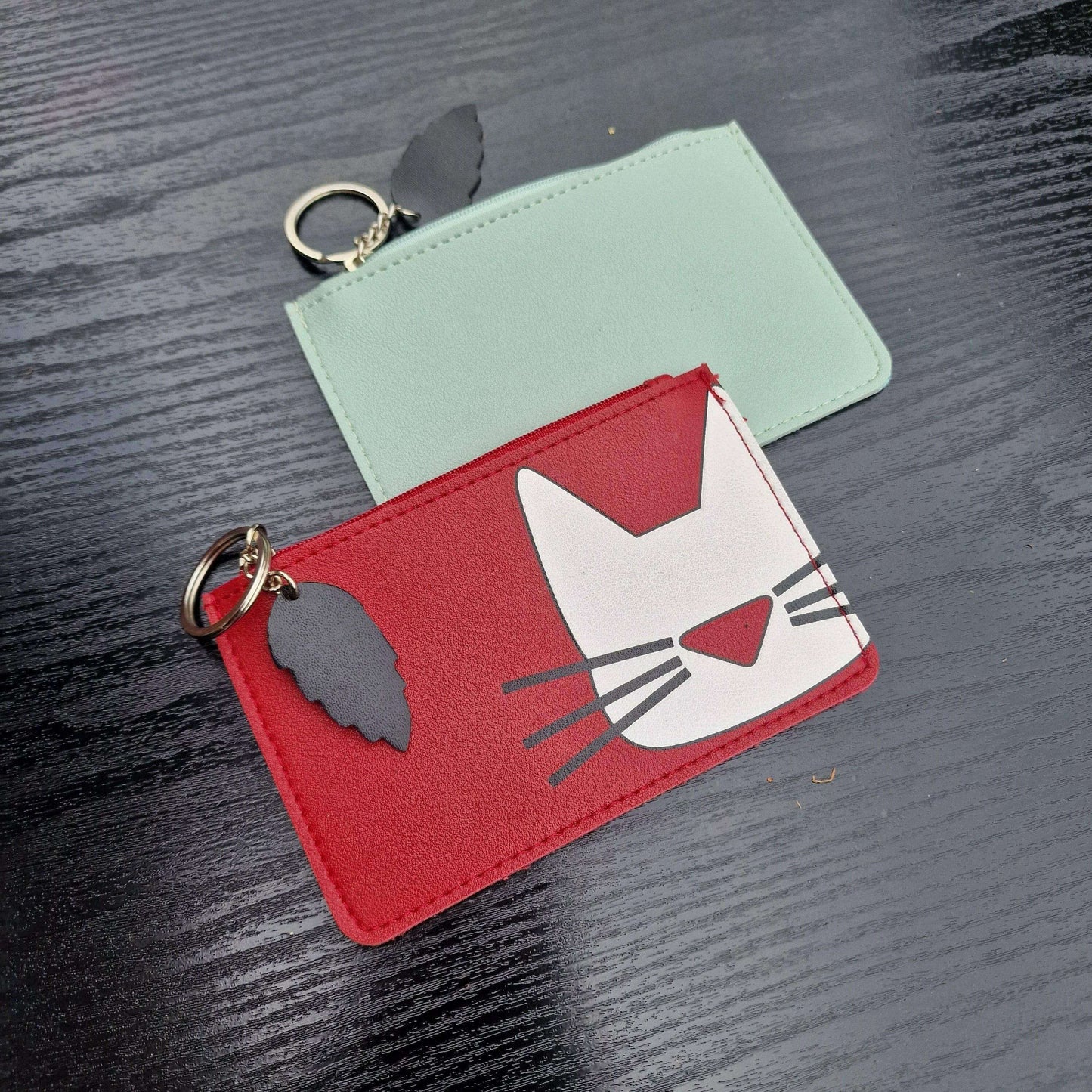 Mint and red cat-face faux leather zipper keyring purses, white graphic on front