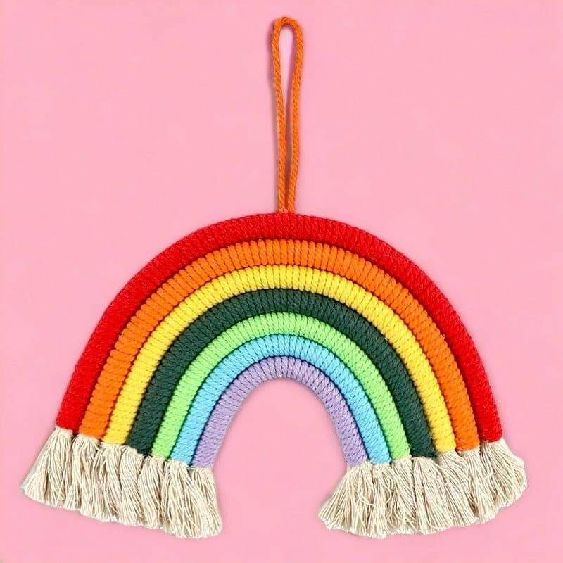Hanging rainbow room decoration featuring multicolor arch and beige tassel fringe on a loop