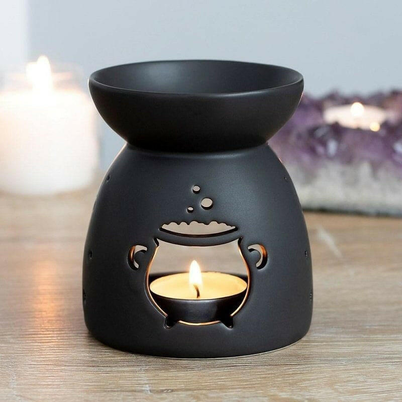 Black cauldron wax melt burner with flame and smiling face cutout
