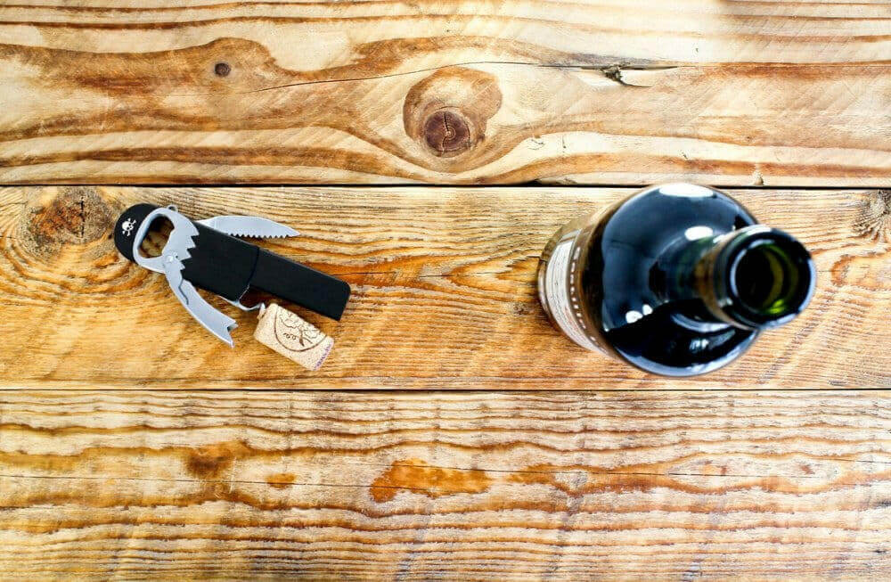 Waiter’s friend bottle opener and corkscrew with serrated opener blade