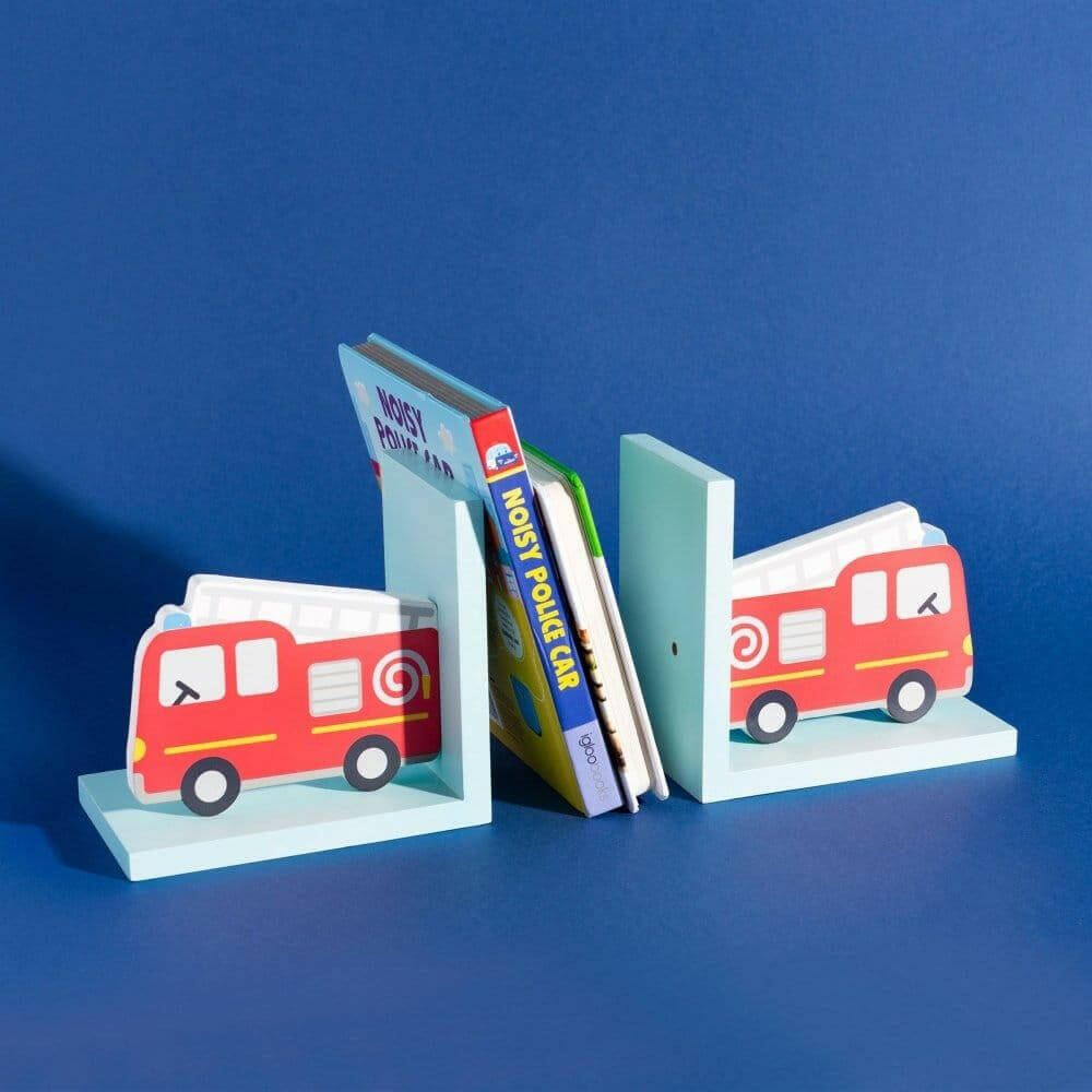 Red fire engine bookends holding books on light blue bases