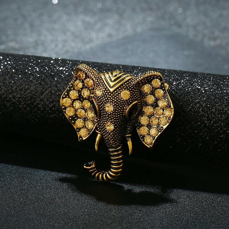 Gold elephant brooch with crystal rhinestones, detailed ears and tusks, close view