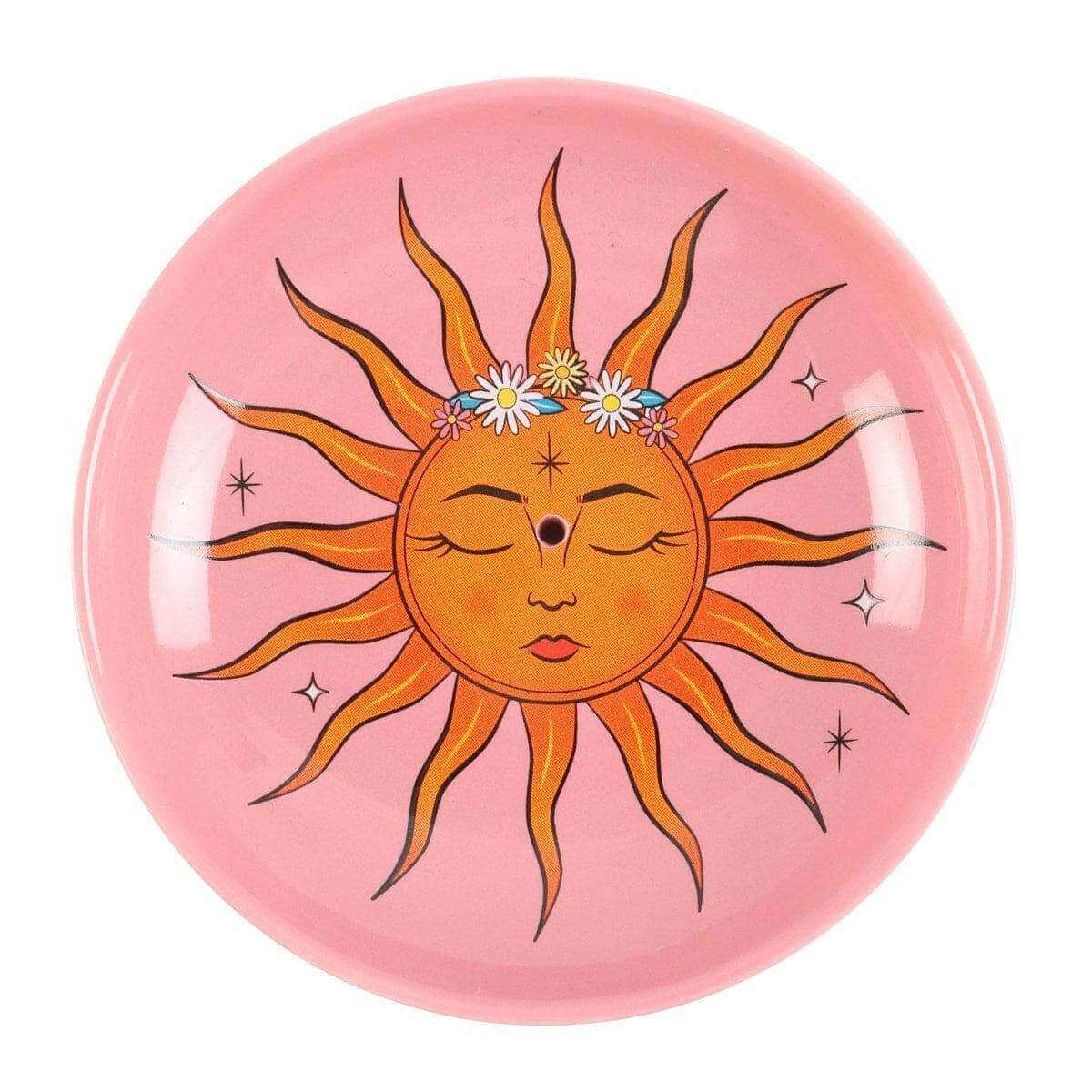 Pink round incense holder with yellow sun face, flower crown, and star rays