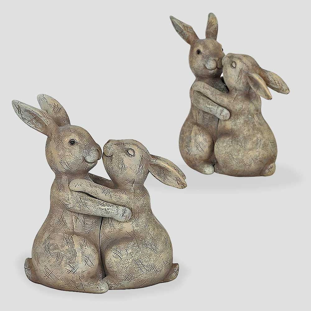 Pair of beige bunny rabbit ornaments hugging, textured resin finish, sitting together