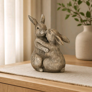 Beige bunny rabbit ornament pair hugging, seated sculpt with textured resin finish
