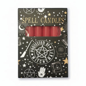 Pack of spell candles with witchcraft-themed packaging on a white background