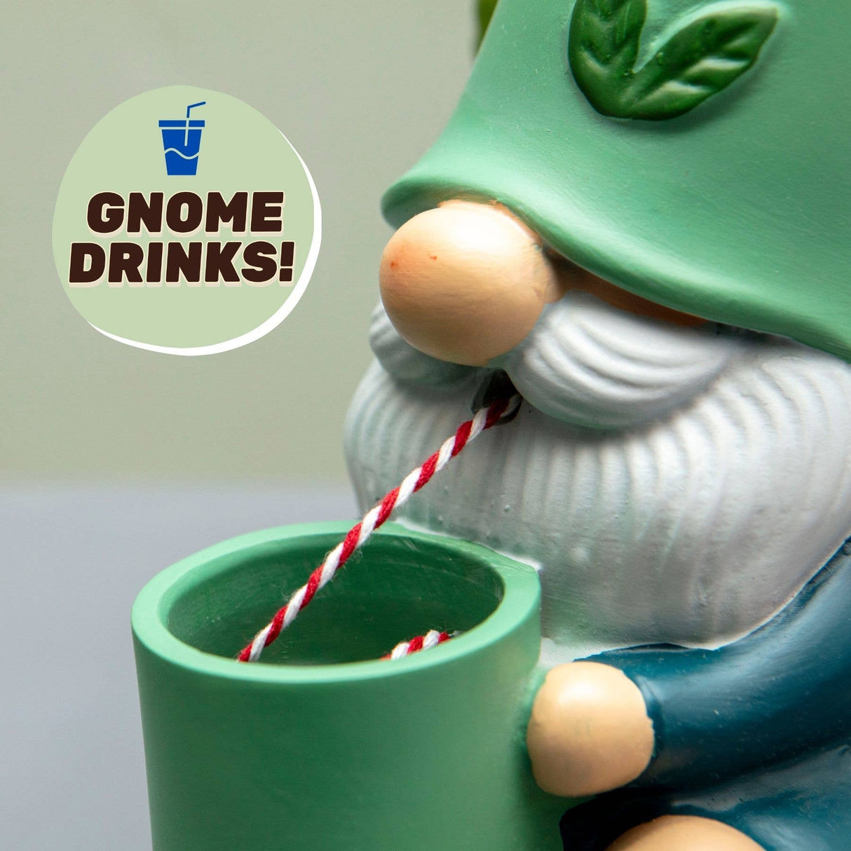 Self-watering gnome plant pot with green cup and red-white rope wick, blue body.
