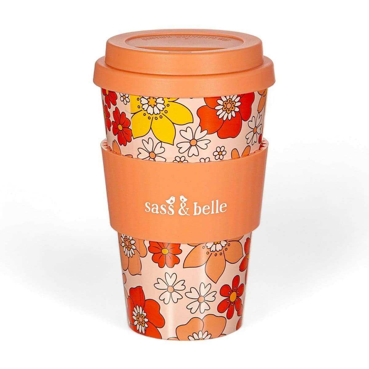Eco reusable travel mug with orange floral sleeve and domed lid, Sass & belle logo