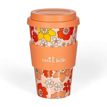Eco reusable travel mug with orange floral sleeve and domed lid, Sass & belle logo