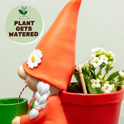 Orange gnome self-watering plant pot with red planter and white blossoms