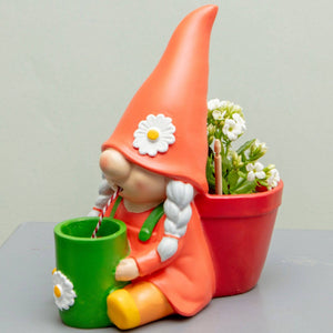 Self-watering gnome plant pot: orange hat, red planter, white flowers