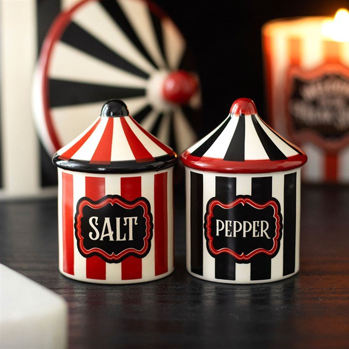 Two circus tent salt and pepper shakers with striped bodies and domed lids