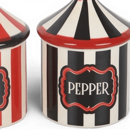 Close-up of circus tent pepper shaker with PEPPER label and striped lid
