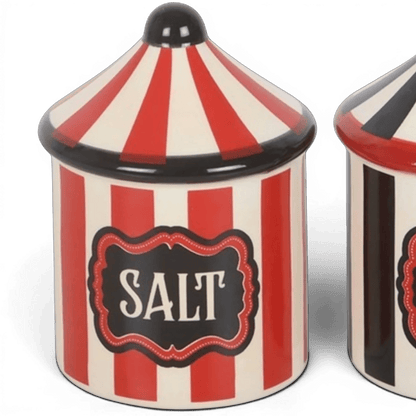 Close-up of circus tent salt shaker with SALT label and red-and-white striped body