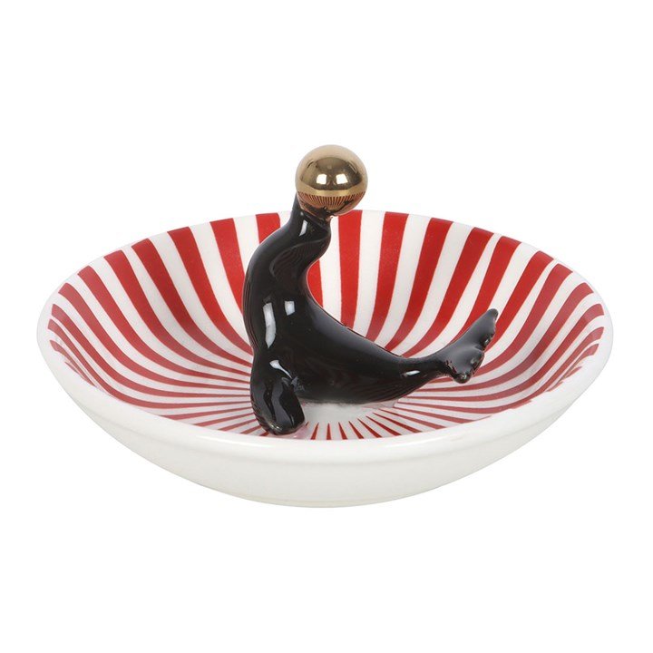 Red-and-white striped trinket dish with glossy black seal standing pose