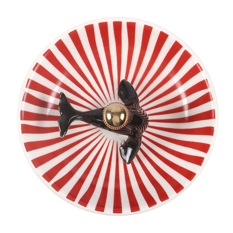 Round red-and-white striped trinket dish with black seal and gold dome cap