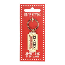 Ticket keyring with gold-tone ring and Admit One to the Abyss rectangular tag