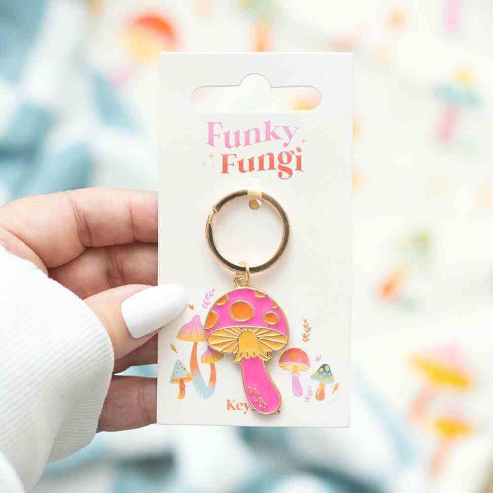 Mushroom keyring with pink and orange enamel charm on a bronze metal ring