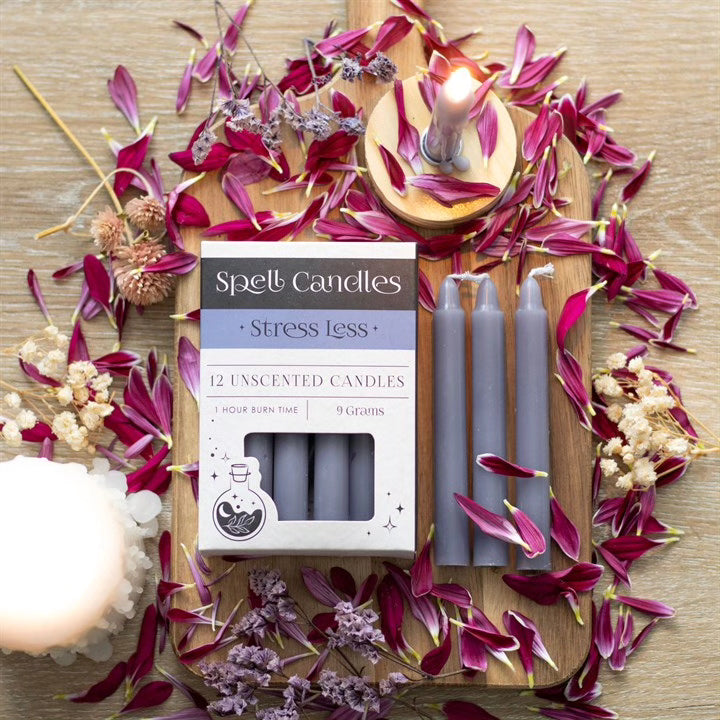 Stress Less spell candles set with lit unscented tapers and product box