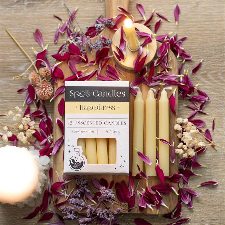 Happiness spell candles set with lit unscented tapers and product box