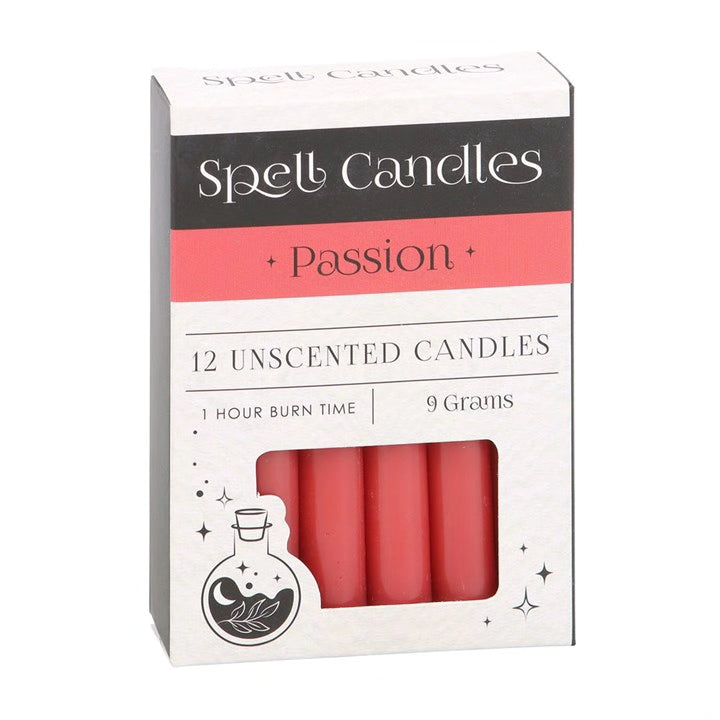 Spell candles box with 12 unscented passion candles, red wax shown in front window