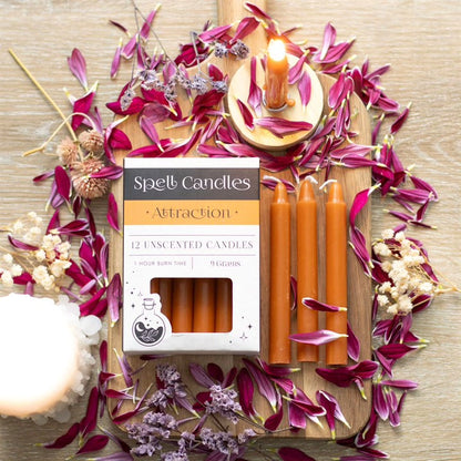 Set of 12 unscented candles with Attraction box and orange candles with lit wicks