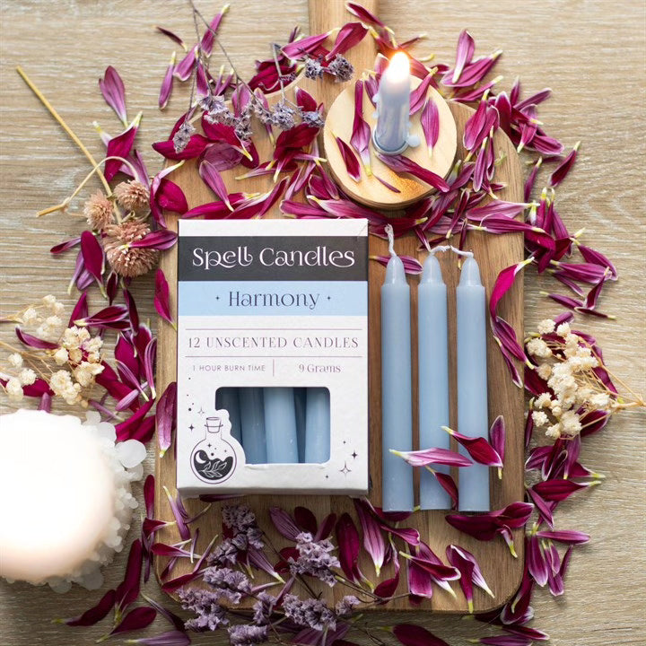 Harmony candle set with three blue pillar candles, magenta petals and herbs