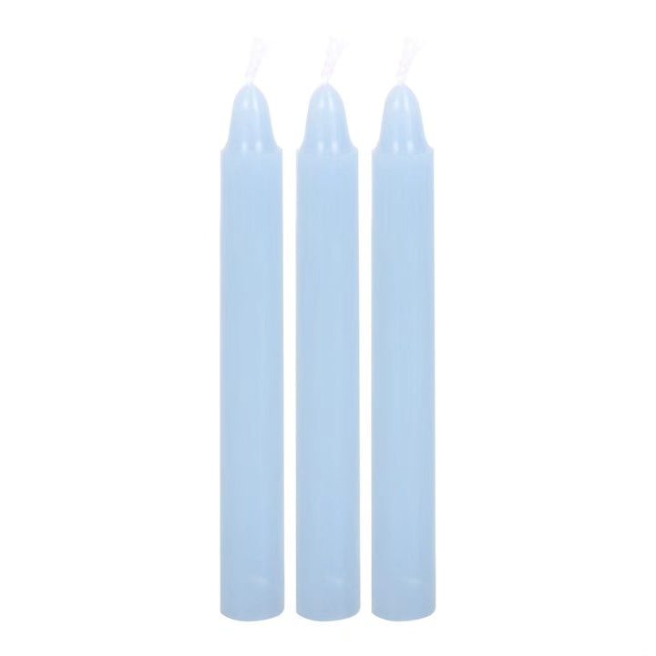 Set of three light blue taper candles with smooth cylindrical bodies
