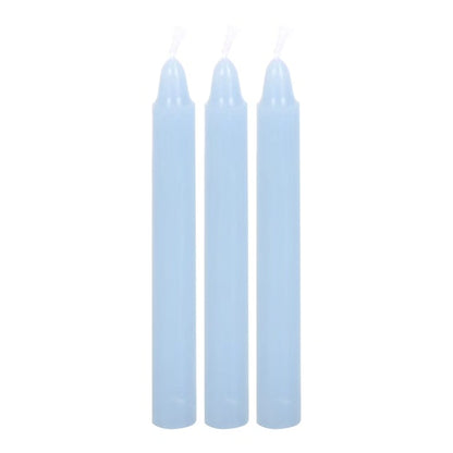 Set of three light blue taper candles with smooth cylindrical bodies