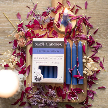 Communication set with blue unlit unscented pillar candles and open box