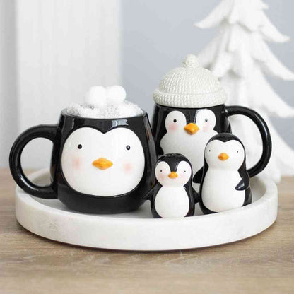 Penguin coffee mug with plush snow top and penguin-shaped sock figures