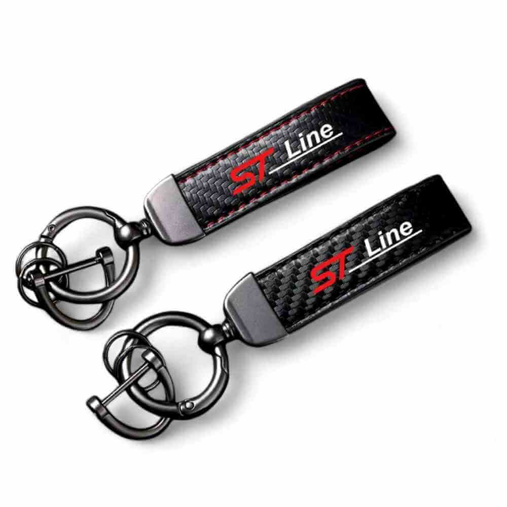 Horseshoe-buckle keychain pair with black carbon-fibre straps and ST Line logo
