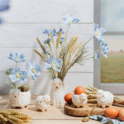 Sheep-shaped egg cups arranged on a rustic breakfast tabletop with eggs