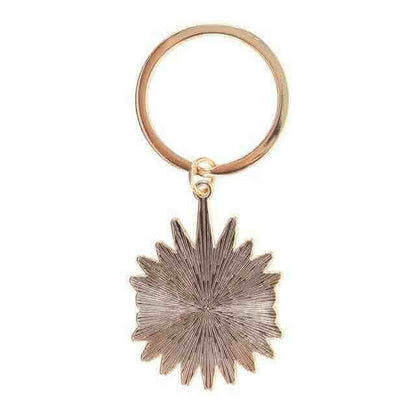 Gold metal keyring with textured sunburst evil eye charm