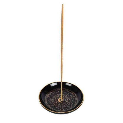 Round black incense holder tray with gold rim and astrology wheel, incense stick included.