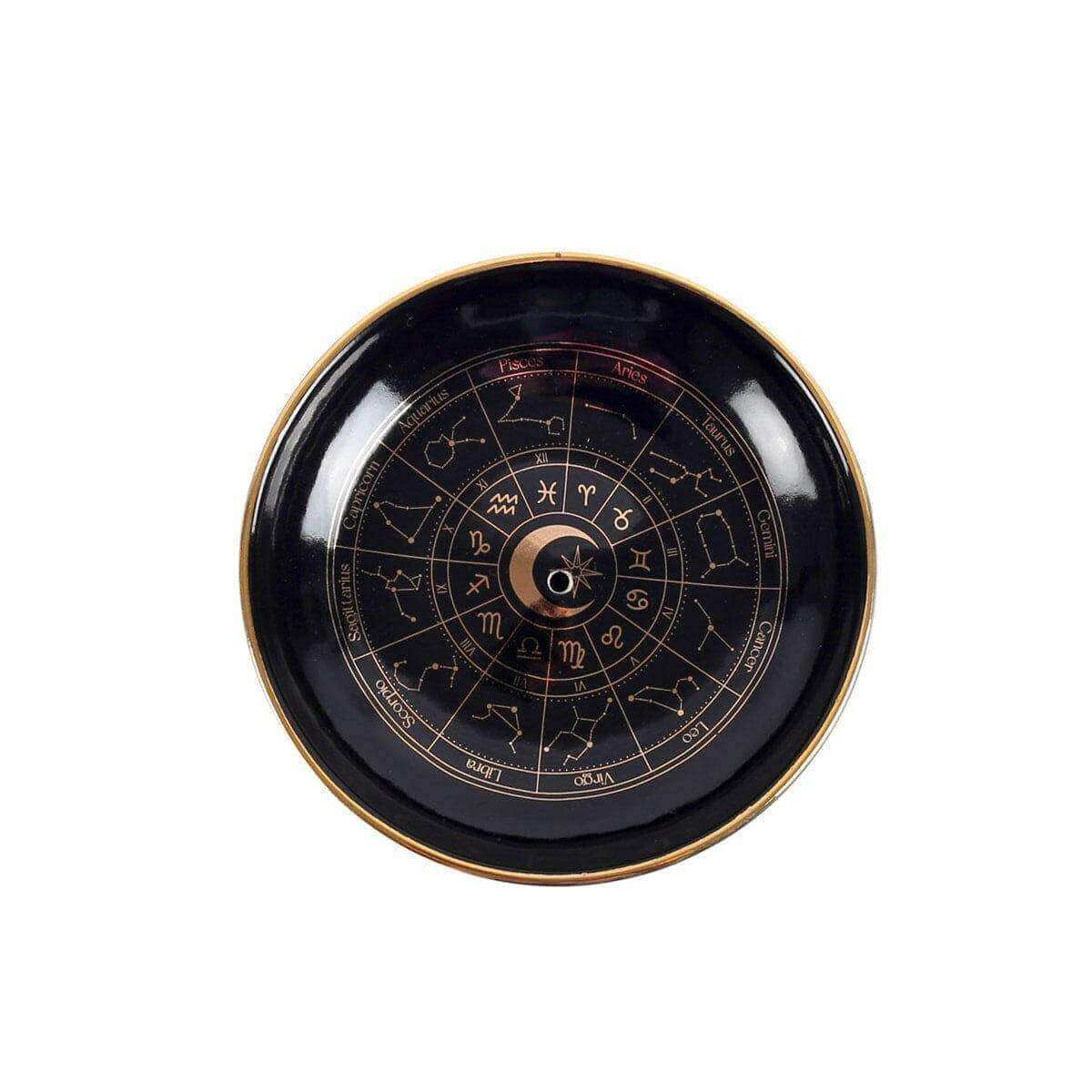 Round black incense holder tray with gold rim and astrology wheel center moon icon.