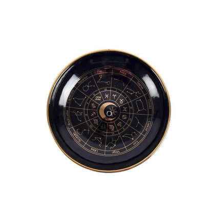 Round black incense holder tray with gold rim and astrology wheel center moon icon.