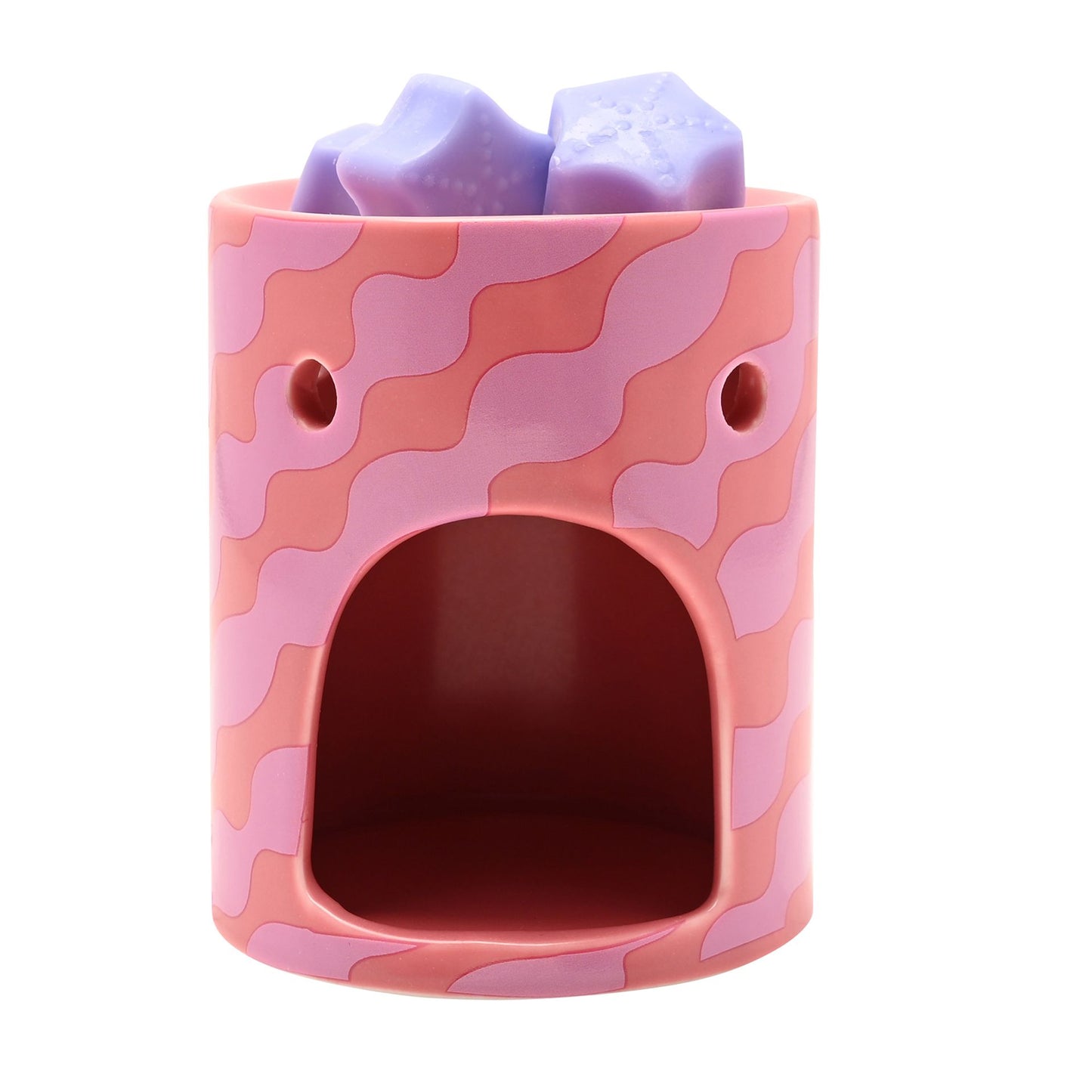 Pink wax melt burner with carved window and lilac star wax melts, unlit