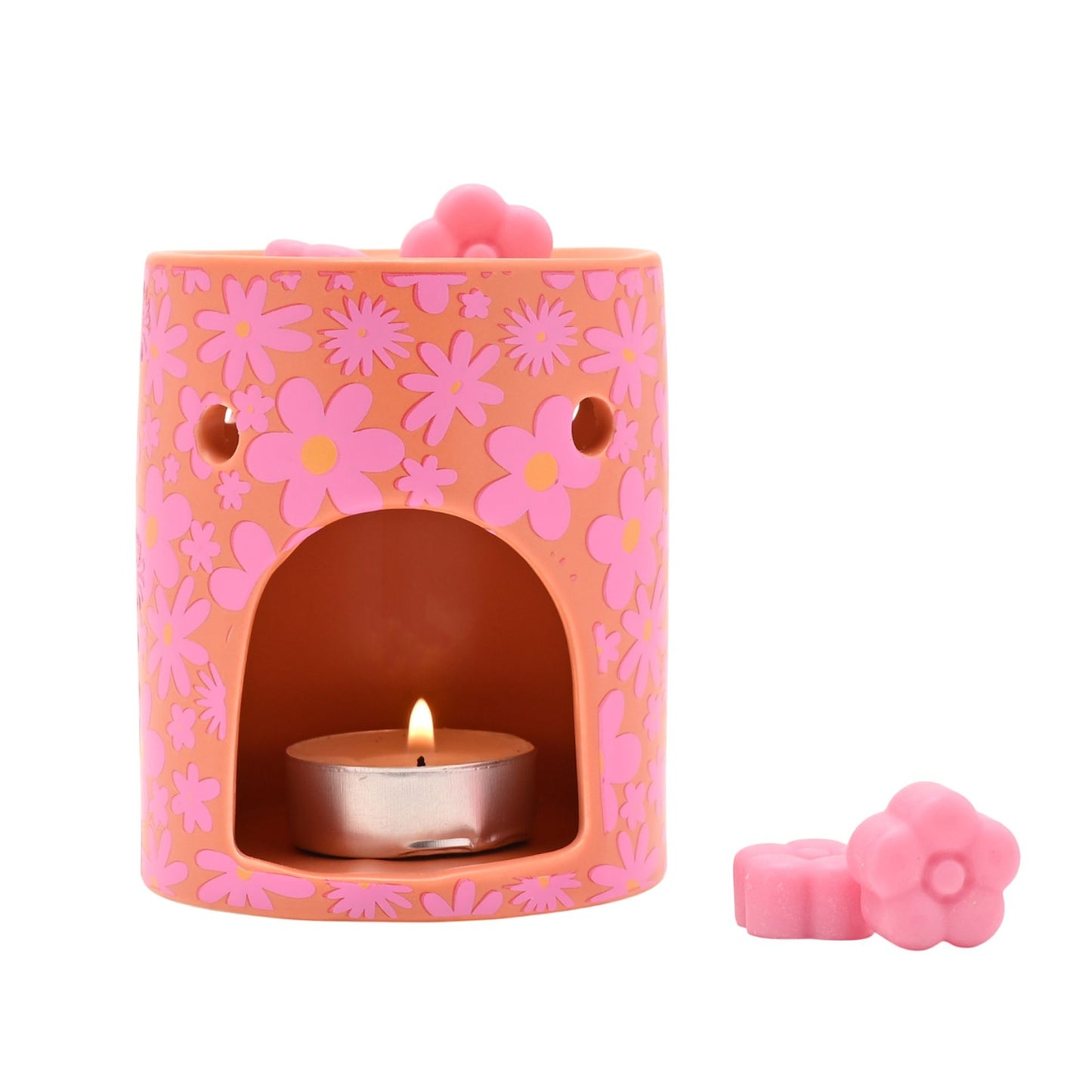 Floral wax melt burner with lit tealight and pink wax melts beside it