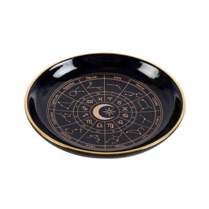 Round black jewellery dish with glossy finish, gold edge, and astrology zodiac wheel