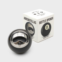 Black 8-ball style bottle opener with stainless blade, shown in retail box